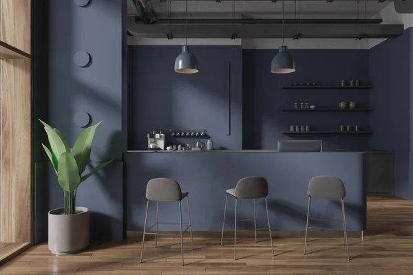 Interior of stylish coffee shop with blue walls, wooden floor, comfortable blue bar counter with stools and shelves with coffee cups. 3d rendering