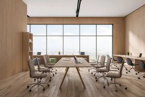 Stylish wooden office interior with armchairs and laptop on desk, hardwood floor. Modern meeting and coworking space, panoramic window on New York. 3D rendering