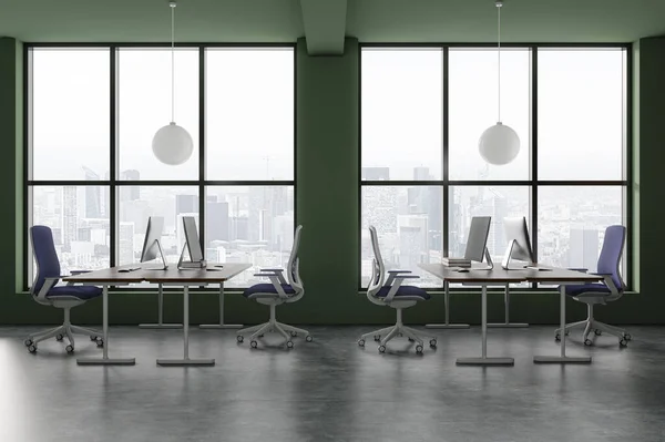 Interior of stylish open space office with green walls, concrete floor, comfortable computer tables with blue chairs standing near big windows with cityscape. 3d rendering