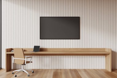 Ev içi rahat çalışma alanı koltuğu ve bilgisayarlı ahşap masa, bej duvar panellerinde televizyon. Modern dairede şık bir çalışma alanı. 3B görüntüleme