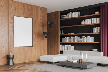 Rahat bir oturma odası kanepe, yan görüş sehpası ve kitaplarla dolu bir kitaplık, ahşap döşeme. Ahşap duvardaki boş posteri taklit et. 3B görüntüleme