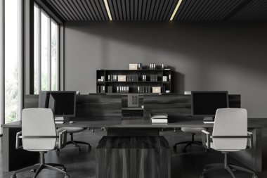 İçi bilgisayarlarla dolu karanlık bir iç mekan. Masanın üzerinde, evraklarla dolu bir raf. Minimalist mobilyaları ve tropiklerde panoramik pencereleri olan modern çalışma alanı. 3B görüntüleme