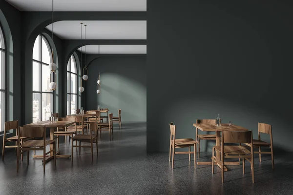Dark restaurant interior with wooden chairs and table in row, grey granite floor. Modern cafe and panoramic window on Kuala Lumpur skyscrapers. Mock up wall partition. 3D rendering