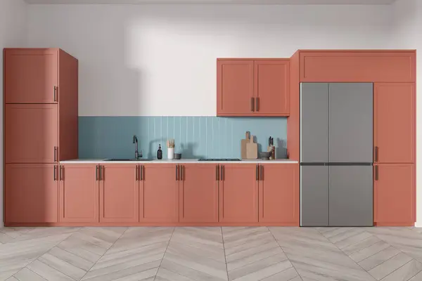 Interior of modern kitchen with white walls, wooden floor, comfortable pink cupboards and cabinets with built in cooker and sink, blue backsplash and big refrigerator. 3d rendering
