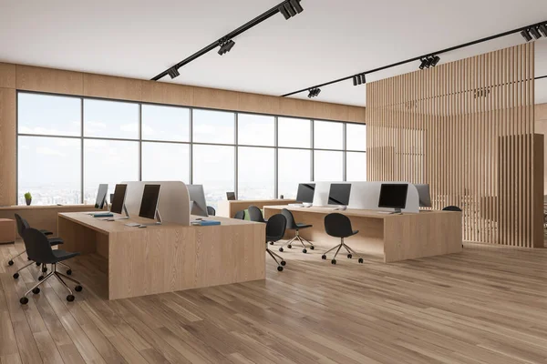 Stylish wooden office interior with chairs and pc desktop, shared desk on hardwood floor. Coworking zone with partition and panoramic window on New York. 3D rendering