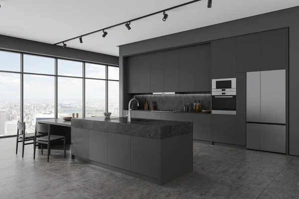 Corner view of kitchen interior with stone bar island and table, cabinet and fridge on grey tile floor. Stylish dining and cooking corner with panoramic window on New York. 3D rendering