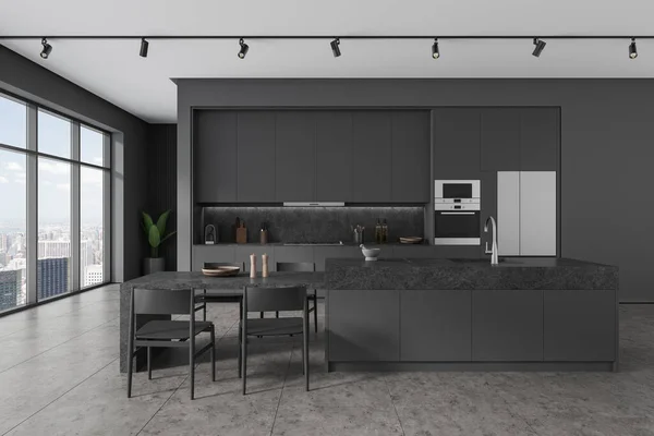 Dark home kitchen interior with stone bar counter and table, cabinet and oven with fridge on grey tile floor. Modern dining and cooking space with panoramic window on New York. 3D rendering