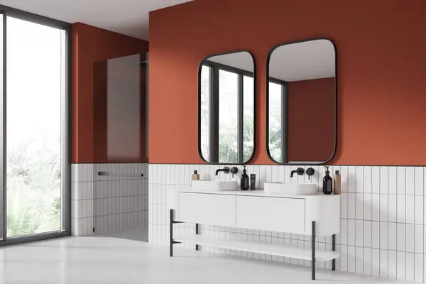 Orange hotel bathroom interior with double sink, vanity and glass shower, side view white concrete floor. Elegant bathing corner with panoramic window on tropics. 3D rendering