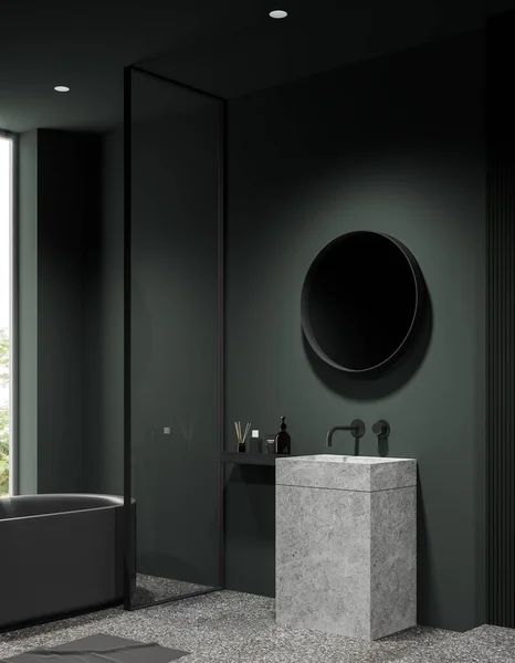 Dark green home bathroom interior with sink and round mirror, side view bathtub behind glass partition. Luxury bathing corner with panoramic window. 3D rendering