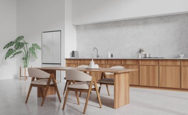 Modern mutfağın köşesinde beyaz duvarlar, beton zemin, lavabo ve fırında yapılmış ahşap dolaplar, büyük buzdolabı ve uzun beyaz sandalyeli yemek masası. 3d oluşturma