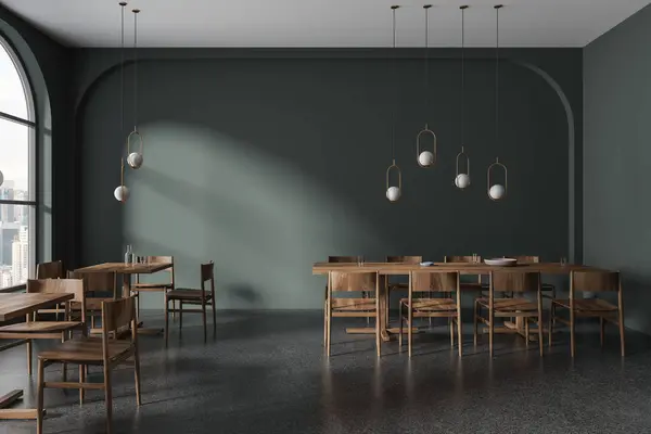 Dark restaurant interior with wooden chairs and table in row, grey granite floor. Stylish eating room in minimalist cafe. Panoramic window on Kuala Lumpur skyscrapers. 3D rendering
