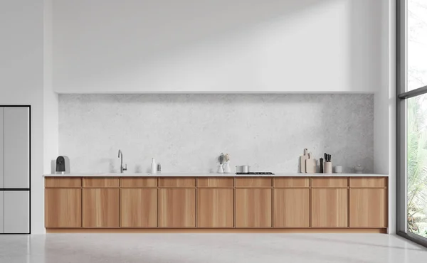 Interiér Moderní Kuchyně Bílými Stěnami Betonovou Podlahou Pohodlnými Dřevěnými Skříněmi — Stock fotografie