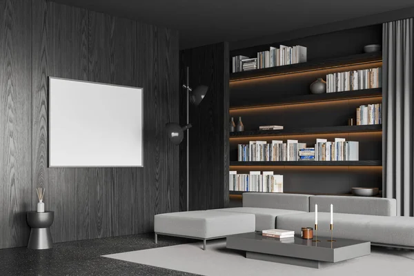 Dark home living room interior with sofa, side view coffee table and shelf with books, carpet on grey granite floor. Mock up blank poster on black wooden wall. 3D rendering