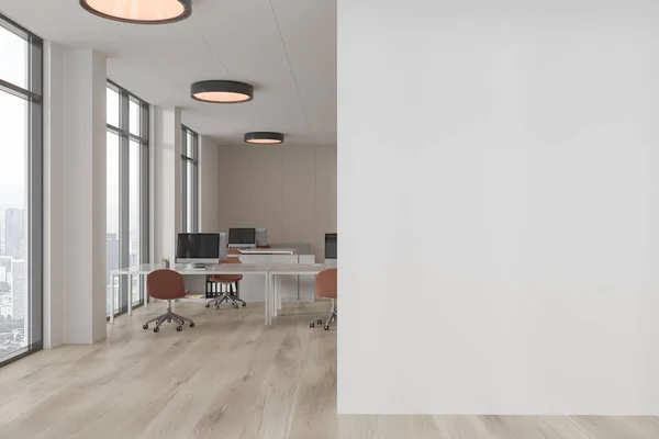 Interior of stylish open space office with white and wooden walls, wooden floor, white computer tables with brown chairs and copy space wall on the right. 3d rendering