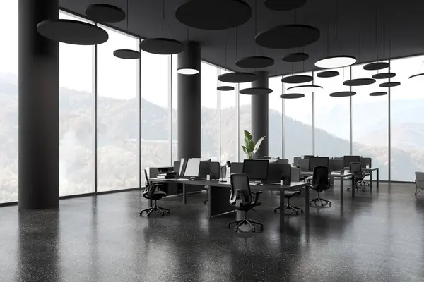 Dark office interior with pc computers and chairs in row, side view grey granite floor. Stylish office work corner with panoramic window on countryside. 3D rendering
