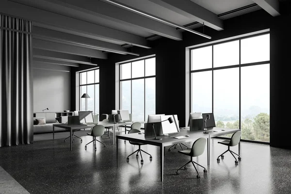Dark coworking interior with pc desktop on table, relax corner with sofa and sideboard near panoramic window on countryside. Modern workplace in company loft. 3D rendering