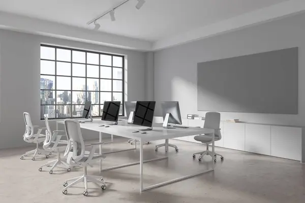 White coworking interior with chairs and pc computers in row, side view light concrete floor. Minimalist workspace with whiteboard and panoramic window on skyscrapers. 3D rendering