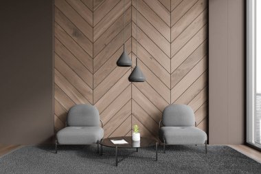 Kahverengi ve koyu ahşap duvarları, ahşap zemini, iki gri koltuğu ve halıda duran cam sehpası olan şık minimalist oturma odasının içi. 3d oluşturma