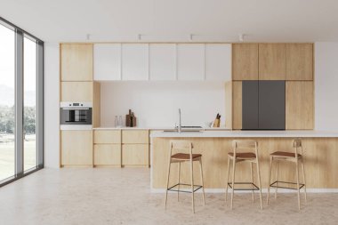 Bar adası, tabure ve bej beton zemini olan samimi bir otel mutfağı. Ahşap ve beyaz yemek odası ve kırsal alanda dolap, buzdolabı ve panoramik pencereli yemek pişirme alanı. 3B görüntüleme