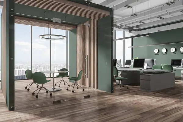Corner of stylish open space office with green and wooden walls, wooden floor, computer desks with green chairs, clocks showing world time and cozy conference room with round table. 3d rendering