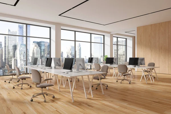 Wooden office loft interior with pc computers, coworking corner with armchairs and desk on hardwood floor. Workspace with furniture in row and panoramic window on New York. 3D rendering