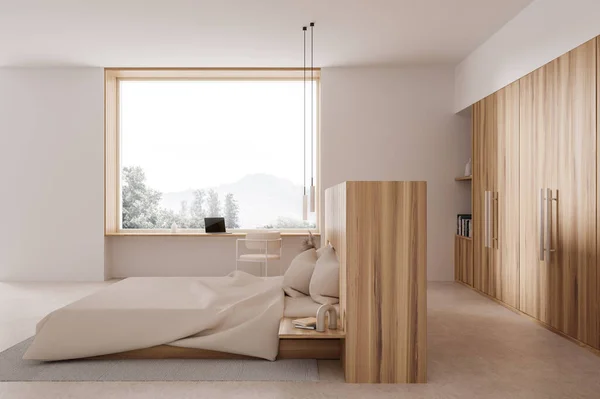 Interior of stylish bedroom with white walls, concrete floor, comfortable king size bed, wooden wardrobe and compact computer table with chair standing near big window. 3d rendering