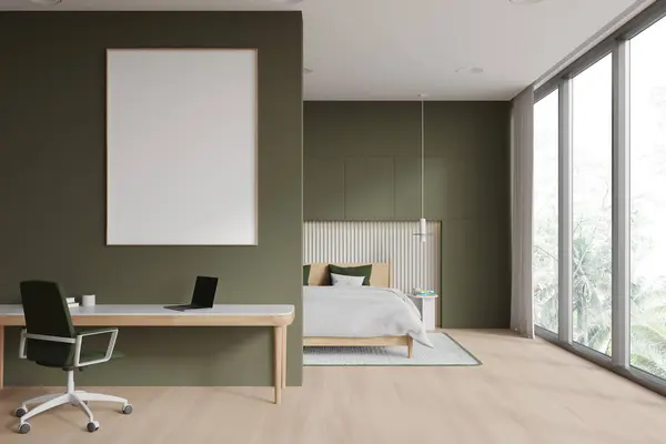 Green hotel bedroom interior with sleep and work zone with desk and laptop, armchair on hardwood floor. Panoramic window on tropics. Mock up canvas poster on partition. 3D rendering