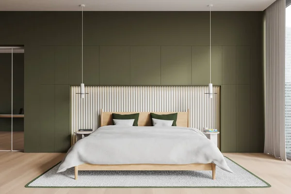 Interior of stylish minimalistic bedroom with green walls, wooden floor, comfortable king size bed with white blanket and two round bedside tables. 3d rendering