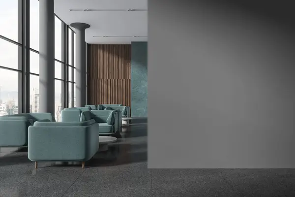 Dark hotel lobby interior with blue sofa and coffee table in row, columns on grey granite floor. Panoramic window on Kuala Lumpur skyscrapers. Mock up copy space partition. 3D rendering