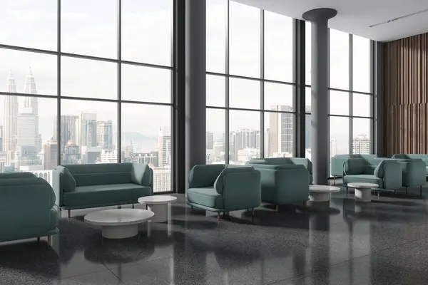 Modern hotel waiting interior with blue sofa and coffee table in row, side view columns on grey tile granite floor. Panoramic window on Kuala Lumpur skyscrapers. 3D rendering