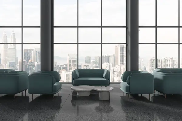 Dark office lounge zone interior with blue sofa and coffee table, columns on grey granite floor. Panoramic window on Kuala Lumpur skyscrapers. 3D rendering