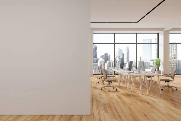 Cozy business interior with pc computers, coworking room with armchairs and shared desk on hardwood floor. Panoramic window on New York skyscrapers. 3D rendering