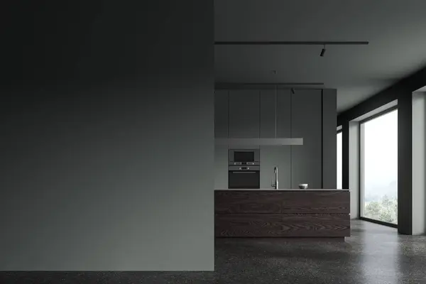 Interior of stylish kitchen with gray walls, concrete floor, comfortable dark wooden island with built in sink and copy space wall on the left. 3d rendering