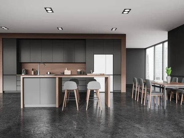 Dark home kitchen interior with bar counter and stylish cabinet design, fridge and eating table with chairs, panoramic window on skyscrapers. 3D rendering