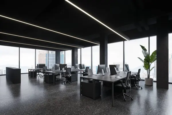 Corner of cozy open space office in industrial style with gray columns, concrete floor, panoramic windows and massive gray computer desks with chairs. 3d rendering