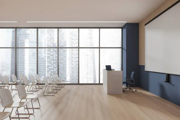 Cozy auditorium interior with chairs in row, desk for speech with blue armchair and pc computer. Mock up copy space projection screen on wall. Panoramic window on Singapore. 3D rendering