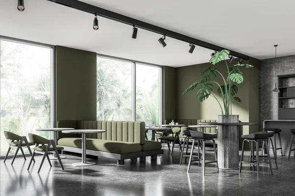 Corner of stylish restaurant with green and gray tiled walls, concrete floor, cozy gray bar counter with stools, round tables with green chairs and comfortable sofa. 3d rendering