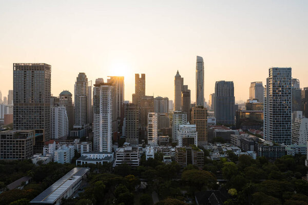 View of Bangkok cityscape with skyscraper towers at sunset. Concept of tourism, business and travel in Thailand