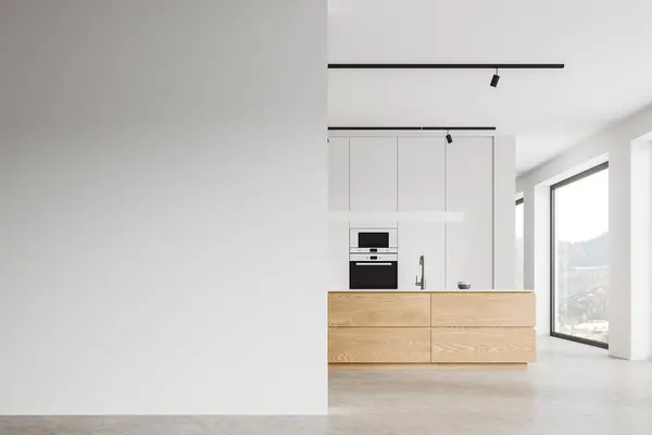 Interior of modern kitchen with white walls, concrete floor, comfortable wooden island with built in sink and copy space wall on the left. 3d rendering