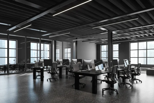 Corner of stylish open space office with gray and glass walls, concrete floor, massive dark wooden computer tables and conference room in background. 3d rendering