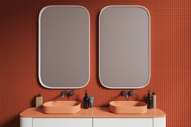 Turuncu fayanslı duvarları olan şık bir banyo ve üzerinde iki dikey ayna olan beyaz şeftali tezgahının üzerinde duran rahat bir çift lavabo. 3d oluşturma