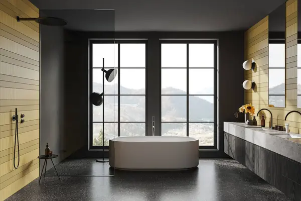Yellow and black home bathroom interior with bathtub, shower with glass partition, double sink with accessories and decoration. Panoramic window on countryside. 3D rendering