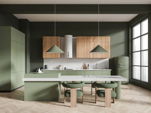 Green home kitchen interior with island table and seats, hardwood floor. Stylish cabinet with kitchenware and refrigerator, panoramic window on skyscrapers. 3D rendering