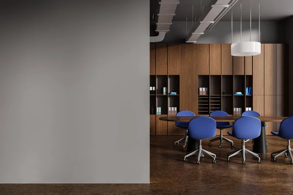 Dark and wooden meeting room interior with board and chairs, brown concrete floor. Minimalist meeting room with shelf and mockup copy space empty blank wall. 3D rendering