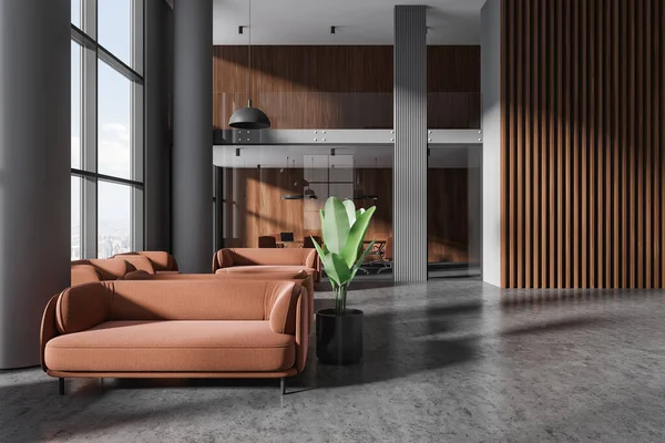 Stylish business room interior with chill and glass meeting room, office lobby with brown sofa and panoramic window on New York city view. 3D rendering