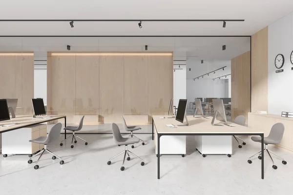 White and wooden workplace interior with chairs and pc computers, desk in row on light concrete floor. Stylish glass office room with sideboard and world clock. 3D rendering