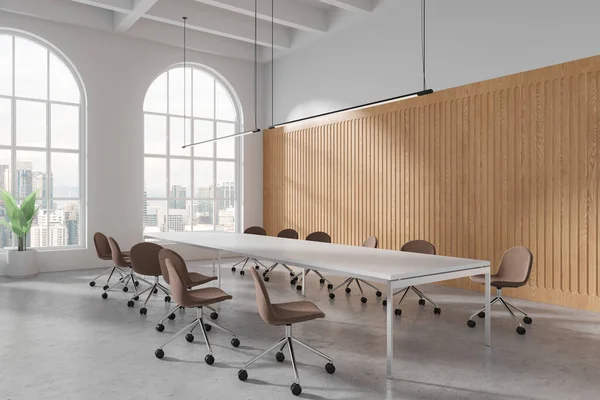 White office interior with chairs and board, side view on light concrete floor. Minimalist meeting corner and panoramic window on Kuala Lumpur skyscrapers. 3D rendering
