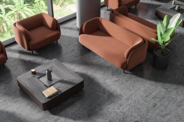 Gri duvarları, sütunları, beton zemini ve kare sehpanın yanında duran rahat kahverengi koltukları olan şık ofis bekleme odasının üst görüntüsü. 3d oluşturma