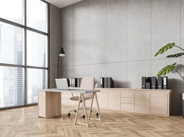 Corner of modern panoramic CEO office with concrete walls, wooden floor, wooden computer table with beige chair and big window with cityscape. 3d rendering