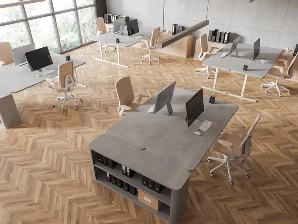 Top view of modern open space office interior with concrete walls, wooden floor, rows of computer desks with beige chairs and panoramic window with tropical view. 3d rendering